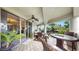 Spacious tiled balcony with comfortable seating, a ceiling fan, and sliding glass doors at 919 Seddon Cove Way # 919, Tampa, FL 33602