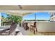 Outdoor balcony features beautiful lake views and a cozy wicker seating set, perfect for relaxation at 919 Seddon Cove Way # 919, Tampa, FL 33602