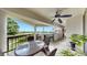 Inviting balcony with ample seating, a ceiling fan, and views of the waterfront at 919 Seddon Cove Way # 919, Tampa, FL 33602