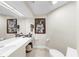 Simple powder room with elongated counter and simple decor at 919 Seddon Cove Way # 919, Tampa, FL 33602