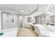 Bright bathroom with glass shower, garden tub and dual vanities at 919 Seddon Cove Way # 919, Tampa, FL 33602