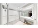 Modern bathroom with glass shower and dual vanity at 919 Seddon Cove Way # 919, Tampa, FL 33602