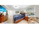 Cozy bedroom with natural light, wood furniture, and decorative accents at 919 Seddon Cove Way # 919, Tampa, FL 33602