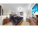 Bright bedroom with a queen bed, framed artwork, and simple decor at 919 Seddon Cove Way # 919, Tampa, FL 33602