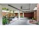 Charming courtyard with brick accents, lush tropical plants, and architectural columns at 919 Seddon Cove Way # 919, Tampa, FL 33602