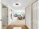 Inviting foyer leads to a bright living room with white walls and neutral carpet at 919 Seddon Cove Way # 919, Tampa, FL 33602