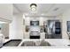 Well-equipped kitchen features modern stainless steel appliances, quartz countertops, and ample cabinetry at 919 Seddon Cove Way # 919, Tampa, FL 33602