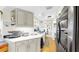 Beautiful kitchen with quartz countertops, white cabinets, stainless steel appliances and wood flooring at 919 Seddon Cove Way # 919, Tampa, FL 33602