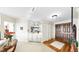 Open-concept living area featuring a mirrored wall, a built-in bar and classic decor at 919 Seddon Cove Way # 919, Tampa, FL 33602
