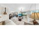 Spacious living room with access to the balcony, neutral color scheme, and natural light at 919 Seddon Cove Way # 919, Tampa, FL 33602