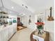 Elegant living space with mirrored bar, hardwood entry, and stylish decor create a welcoming atmosphere at 919 Seddon Cove Way # 919, Tampa, FL 33602
