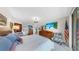 Bright main bedroom with hardwood dressers, a television, and balcony access at 919 Seddon Cove Way # 919, Tampa, FL 33602