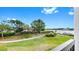 Beautiful view of a manicured lawn, gardens, and waterfront from the building at 919 Seddon Cove Way # 919, Tampa, FL 33602
