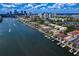 Panoramic aerial shot of waterfront properties with private boat docks and cityscape in the distance at 927 Anchorage Rd, Tampa, FL 33602