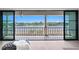 Gorgeous water view from covered balcony with beautiful columns and outdoor living space at 927 Anchorage Rd, Tampa, FL 33602