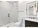 Bathroom featuring glass door shower, a white toilet, and a vanity with marble countertop and sink at 927 Anchorage Rd, Tampa, FL 33602