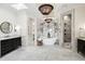 Spacious bathroom with marble floors, modern tub, glass shower, and black accents at 927 Anchorage Rd, Tampa, FL 33602