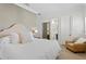 Bright bedroom featuring a luxurious bed and a cozy sitting area with private bathroom at 927 Anchorage Rd, Tampa, FL 33602