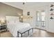 Cozy bedroom with a textured wall, white furniture, and a walk-out balcony with a garden view at 927 Anchorage Rd, Tampa, FL 33602