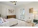 Bright bedroom with a walk-out balcony, complemented by a cozy carpet and white walls at 927 Anchorage Rd, Tampa, FL 33602