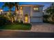 Beautiful two-story home with an arched entryway, well-maintained lawn, and attached garage at 927 Anchorage Rd, Tampa, FL 33602
