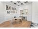 Bright office featuring elegant wainscoting, unique desk, coffered ceiling, and modern decor at 927 Anchorage Rd, Tampa, FL 33602