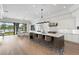 A sprawling kitchen with a large island, barstool seating, and a view of the water at 927 Anchorage Rd, Tampa, FL 33602
