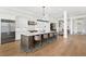 Spacious kitchen with an eat-in island with modern stools, high-end appliances, and an open concept layout at 927 Anchorage Rd, Tampa, FL 33602