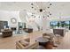 Bright and open living room with staircase, fireplace, and water view at 927 Anchorage Rd, Tampa, FL 33602