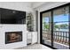 Fireplace with tv and bar area leads to beautiful water view on the outdoor balcony at 927 Anchorage Rd, Tampa, FL 33602