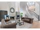 Comfortable living room showing a stone fireplace, modern staircase, and neutral colored furniture at 927 Anchorage Rd, Tampa, FL 33602