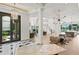 Bright and open living room with staircase, fireplace, and large windows at 927 Anchorage Rd, Tampa, FL 33602