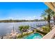 Stunning pool and dock with lift overlook the water and downtown skyline at 927 Anchorage Rd, Tampa, FL 33602