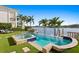 Pool with spa, lawn seating, and tranquil waterfront views offer ultimate relaxation at 927 Anchorage Rd, Tampa, FL 33602