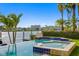 Luxury waterfront pool and spa are surrounded by lush landscaping and city views at 927 Anchorage Rd, Tampa, FL 33602