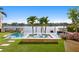 Beautiful backyard pool and spa with waterfront views, surrounded by lush landscaping at 927 Anchorage Rd, Tampa, FL 33602