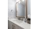 Elegant powder room with modern vanity, stylish mirror, updated fixtures, and sleek design at 935 Eden Isle Ne Dr, St Petersburg, FL 33704