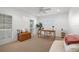 Bright home office with white trim, plantation shutters, and ample sunlight at 935 Eden Isle Ne Dr, St Petersburg, FL 33704