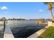 Waterfront view from the dock, showcasing the water access and property features at 935 Eden Isle Ne Dr, St Petersburg, FL 33704
