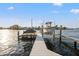 Private boat dock with boat lift providing convenient water access and storage at 935 Eden Isle Ne Dr, St Petersburg, FL 33704
