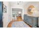 Open foyer with wood floors, a charming console table, and an open view of the bright living spaces at 935 Eden Isle Ne Dr, St Petersburg, FL 33704