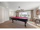 Spacious game room with a waterfront view and pool table at 935 Eden Isle Ne Dr, St Petersburg, FL 33704