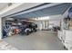 Spacious garage with epoxy flooring, storage shelves, and a golf cart, providing ample space at 935 Eden Isle Ne Dr, St Petersburg, FL 33704