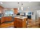 Spacious kitchen with island flows into the living area, creating an ideal open-concept living space at 935 Eden Isle Ne Dr, St Petersburg, FL 33704