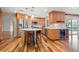 Bright kitchen with stainless steel appliances, light countertops, and a convenient island with bar seating at 935 Eden Isle Ne Dr, St Petersburg, FL 33704