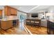 Modern kitchen adjacent to the living room features a wine cooler and backyard pool access at 935 Eden Isle Ne Dr, St Petersburg, FL 33704
