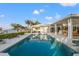 Outdoor pool and patio area, perfect for entertaining with an outdoor kitchen and relaxing lounge areas at 935 Eden Isle Ne Dr, St Petersburg, FL 33704