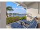 Picturesque waterfront view from the patio with lounge chairs, offering a serene and relaxing outdoor experience at 935 Eden Isle Ne Dr, St Petersburg, FL 33704