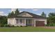 Inviting single-story home featuring a stone facade, attached garage, and well-manicured lawn at 9396 Minnow Ray Dr, Land O Lakes, FL 34638