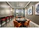 Beautiful game room with comfortable seating, accent lighting, and oversized artwork at 9396 Minnow Ray Dr, Land O Lakes, FL 34638
